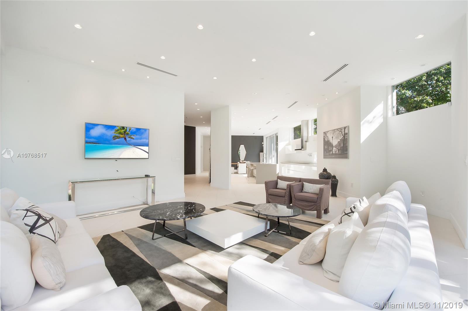 4080 Ensenada Avenue Miami, FL 33133 - Photo 2 of 20 a living room with furniture and a large window