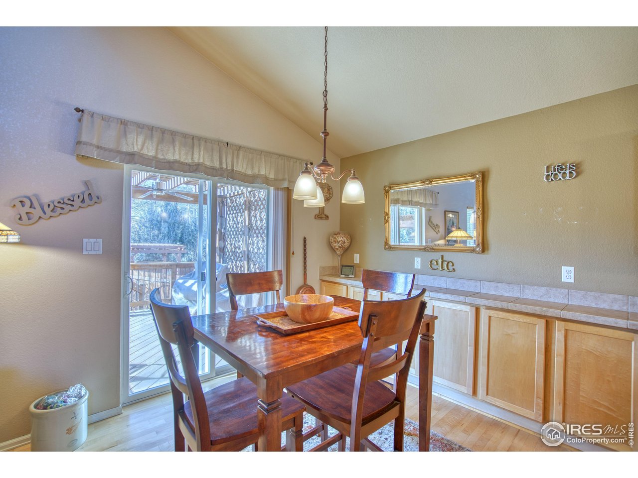 6727 Thistle Ridge Avenue Firestone, CO 80504 - Photo 12 of 40 a dining room with furniture and window