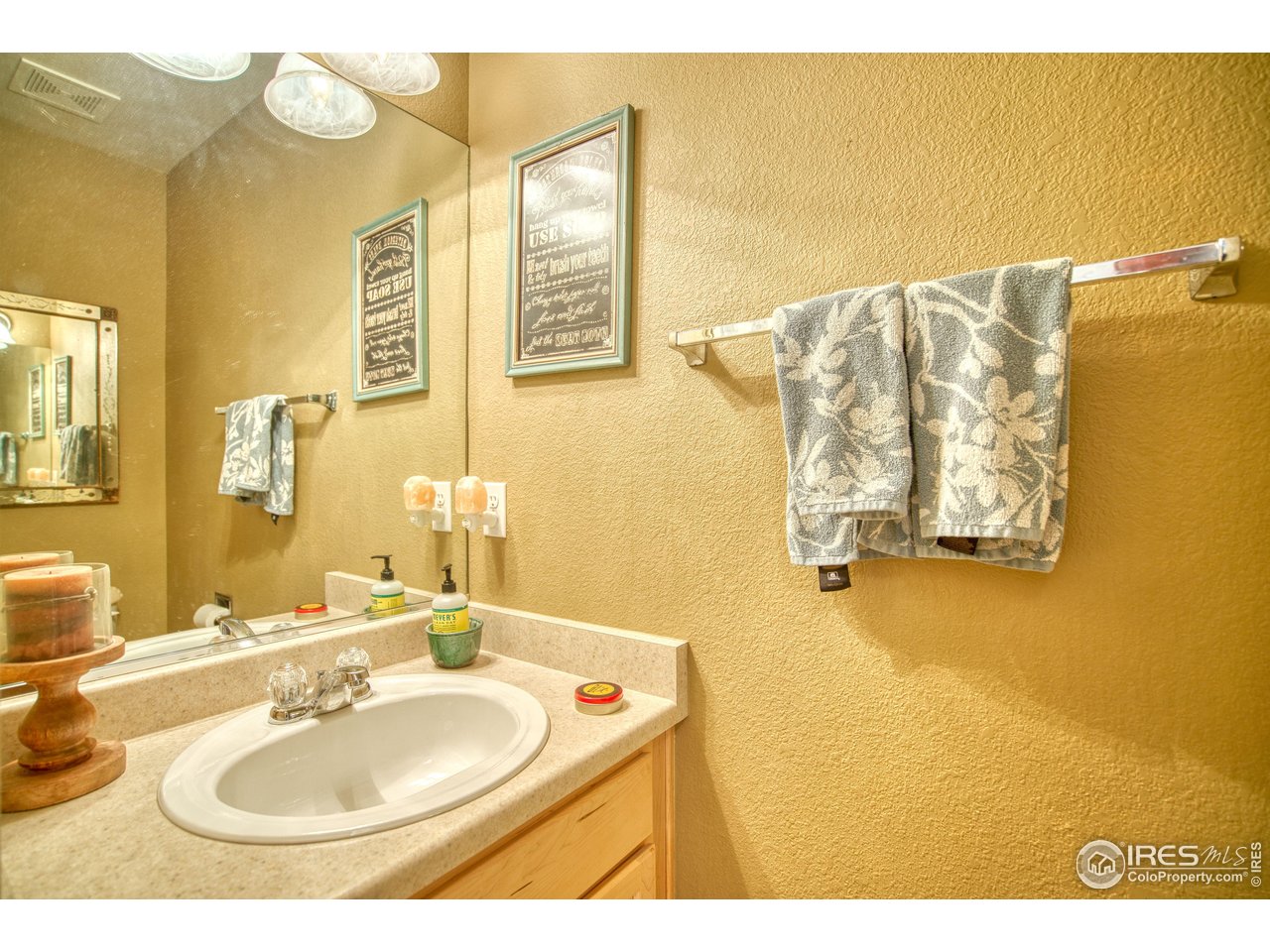 6727 Thistle Ridge Avenue Firestone, CO 80504 - Photo 20 of 40 a bathroom with a sink and a mirror