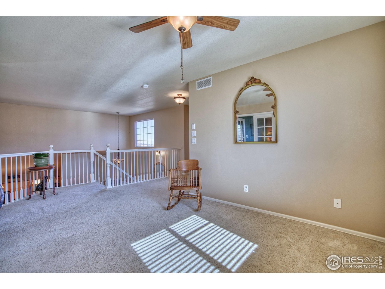 6727 Thistle Ridge Avenue Firestone, CO 80504 - Photo 21 of 40 a living room with furniture