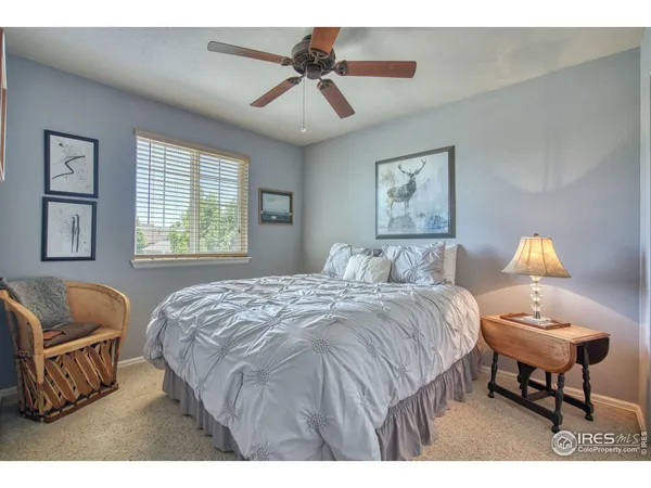a bedroom with a bed and a couch