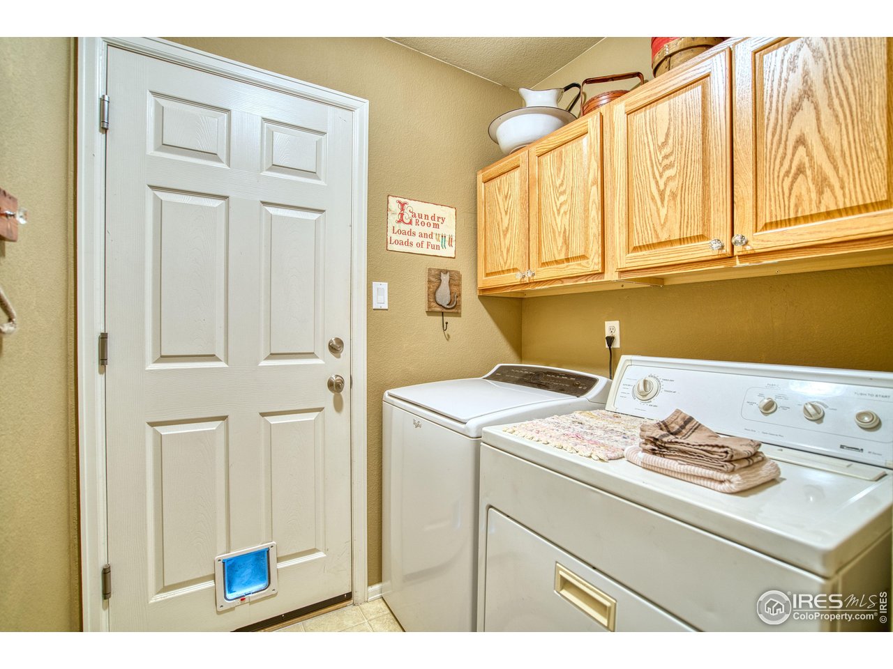 6727 Thistle Ridge Avenue Firestone, CO 80504 - Photo 30 of 40 a utility room with dryer and washer
