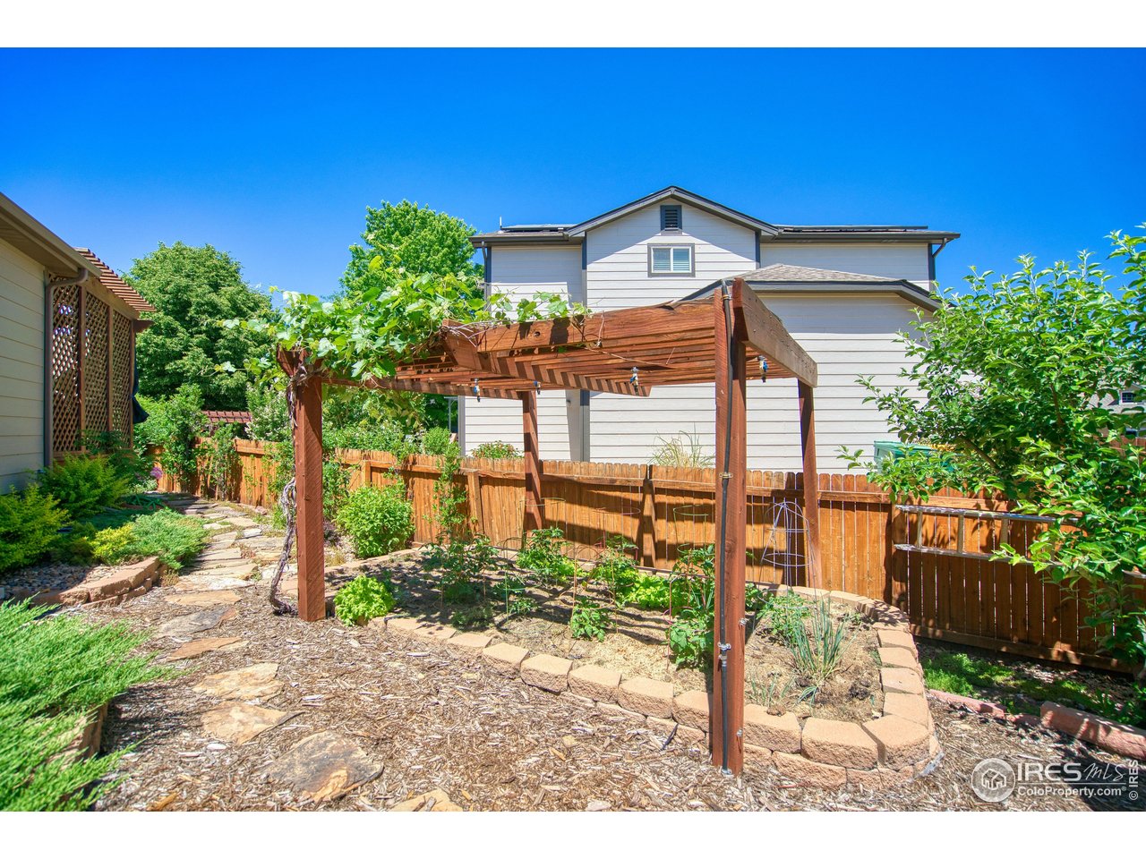 6727 Thistle Ridge Avenue Firestone, CO 80504 - Photo 37 of 40 a view of a house with a yard