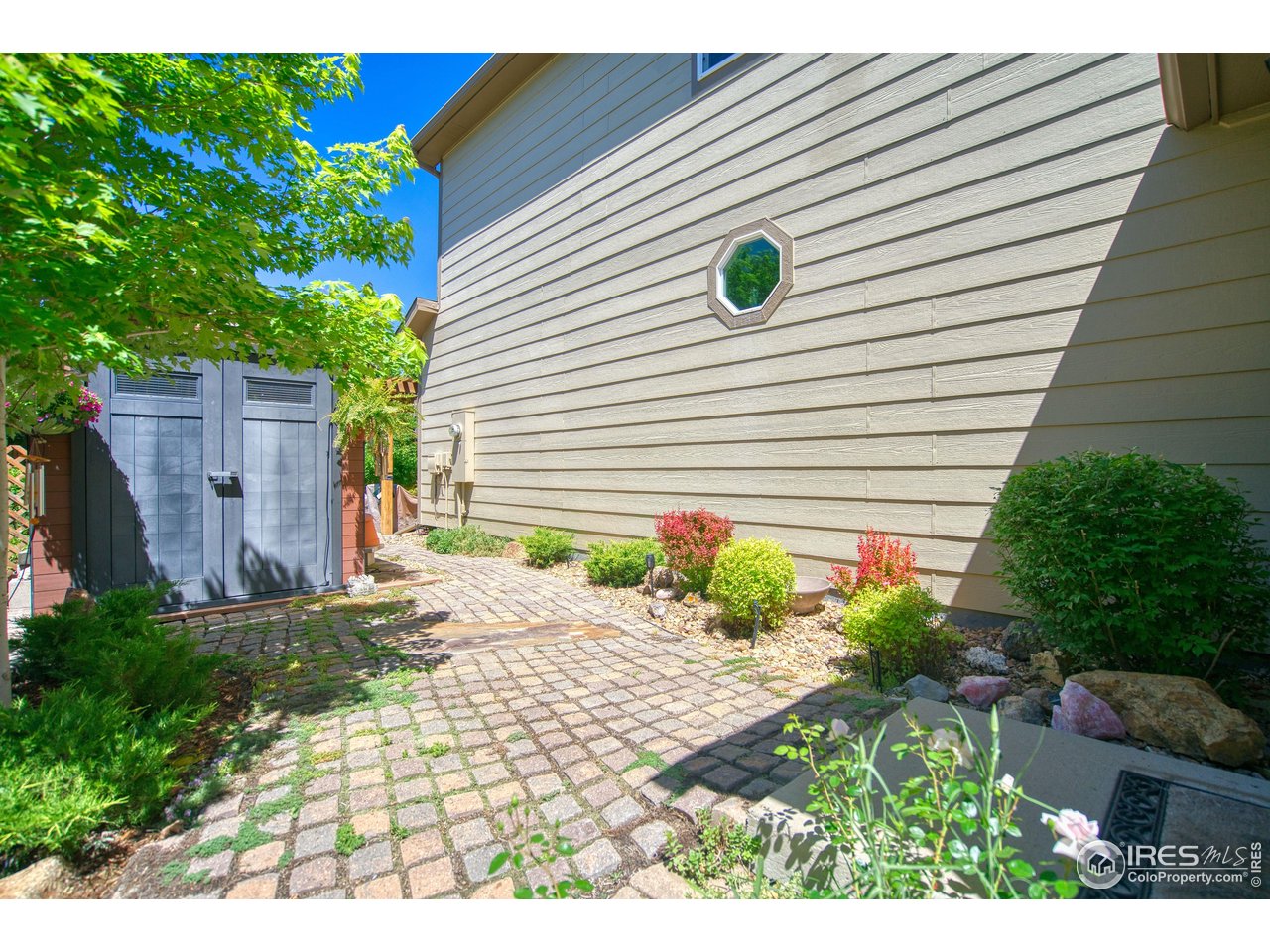 6727 Thistle Ridge Avenue Firestone, CO 80504 - Photo 38 of 40 a view of a backyard with a garden