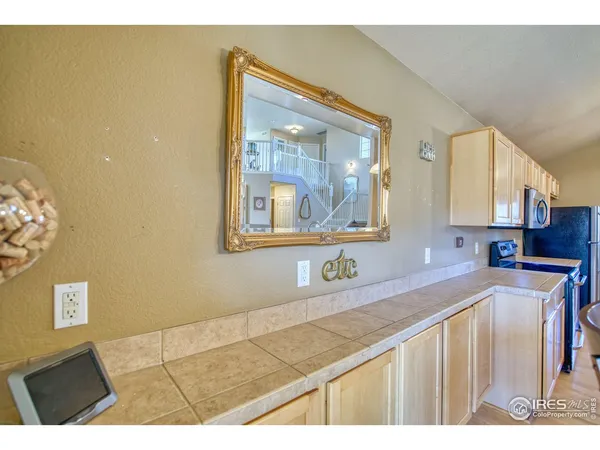 a kitchen with a sink cabinets and a granite counter top