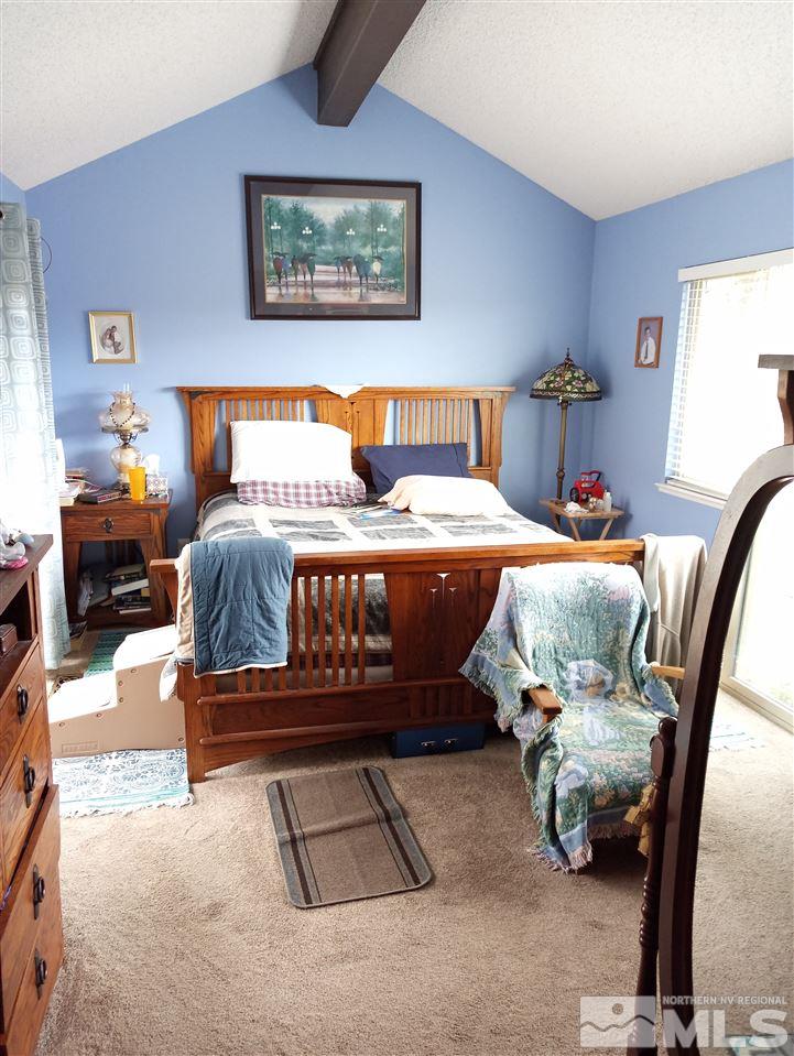 3422 Bowie Road Reno, NV 89503 - Photo 12 of 13 a bedroom with a bed and wooden floor