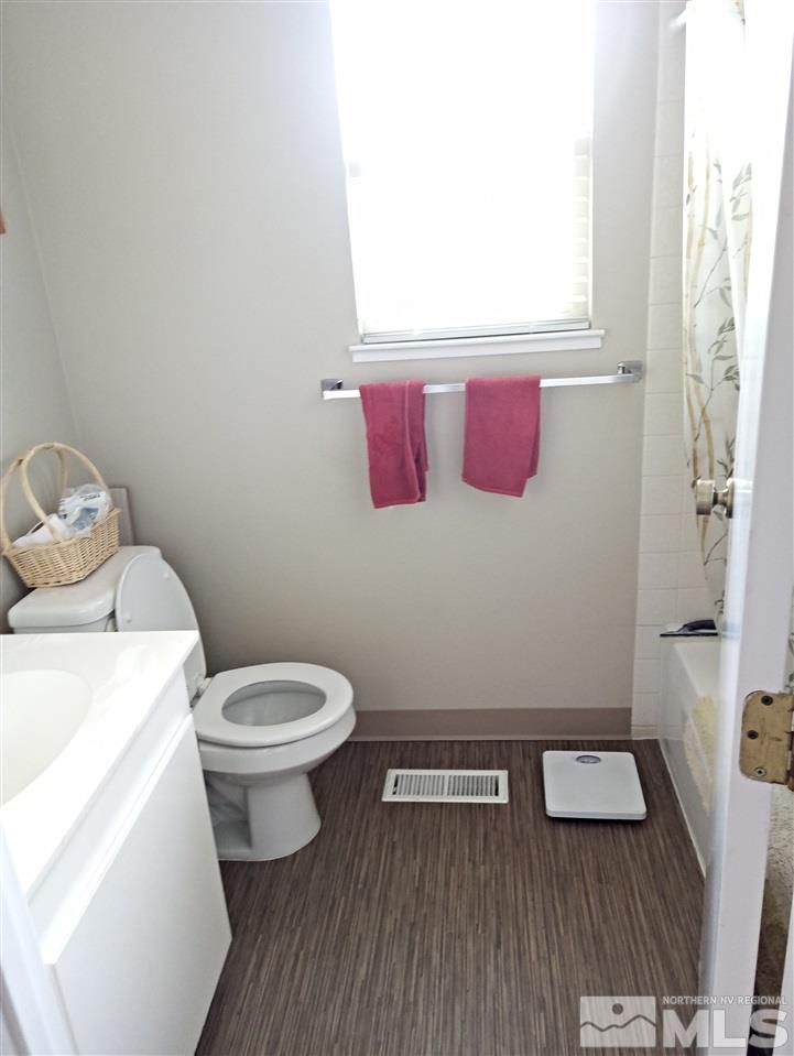 3422 Bowie Road Reno, NV 89503 - Photo 9 of 13 a bathroom with a toilet and a sink