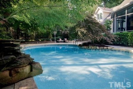 8036 Hawkshead Road Wake Forest, NC 27587 - Photo 3 of 25 This custom Salt-Water Pool and mature landscaping allows privacy & solitude or festive occasions -