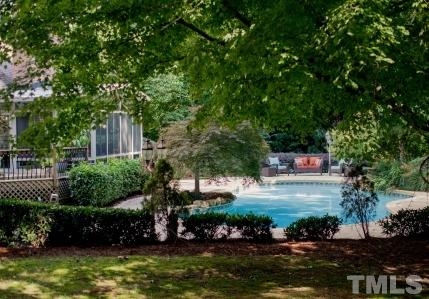 8036 Hawkshead Road Wake Forest, NC 27587 - Photo 6 of 25 This view provides a glimpse of the rear yard and pool, with several decks and seating areas for relaxing and entertaining.
