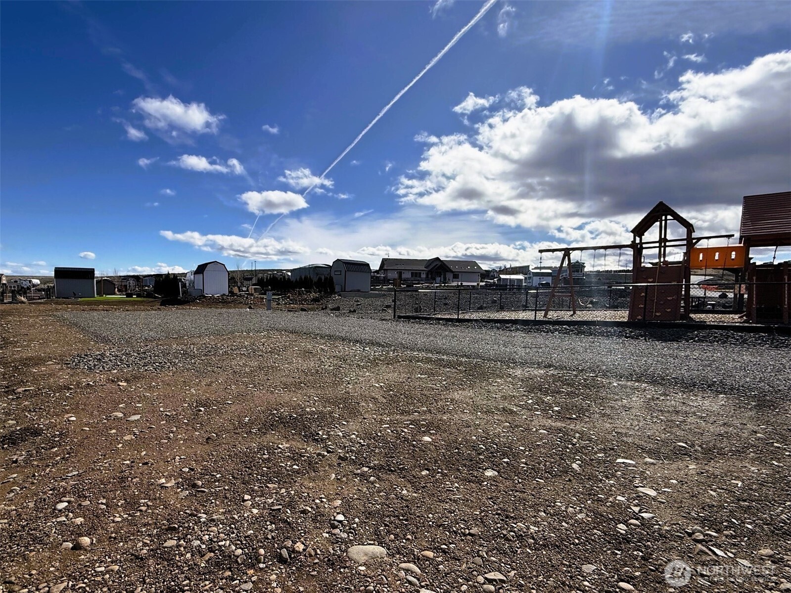 1769 Naches Wenas Road, Unit 123 Selah, WA 98942 - Photo 2 of 10 a view of a big yard next to a building