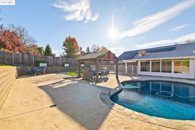a view of a swimming pool with a lounge chairs