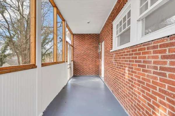 a bathroom with a bathtub and a window