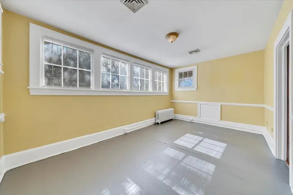a bathroom with a bathtub and a toilet