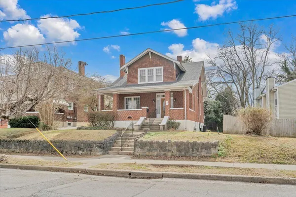 a front view of a house with parking area