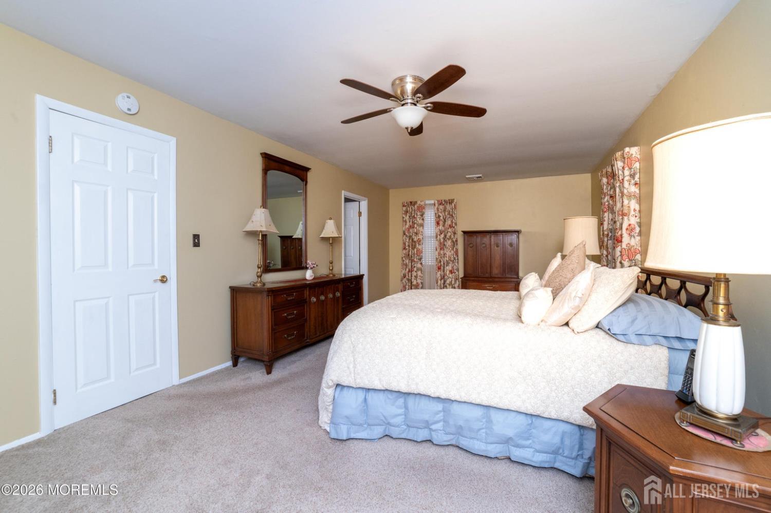2 Brentwood Road Old Bridge, NJ 07747 - Photo 18 of 30 a bedroom with a bed and wooden floor