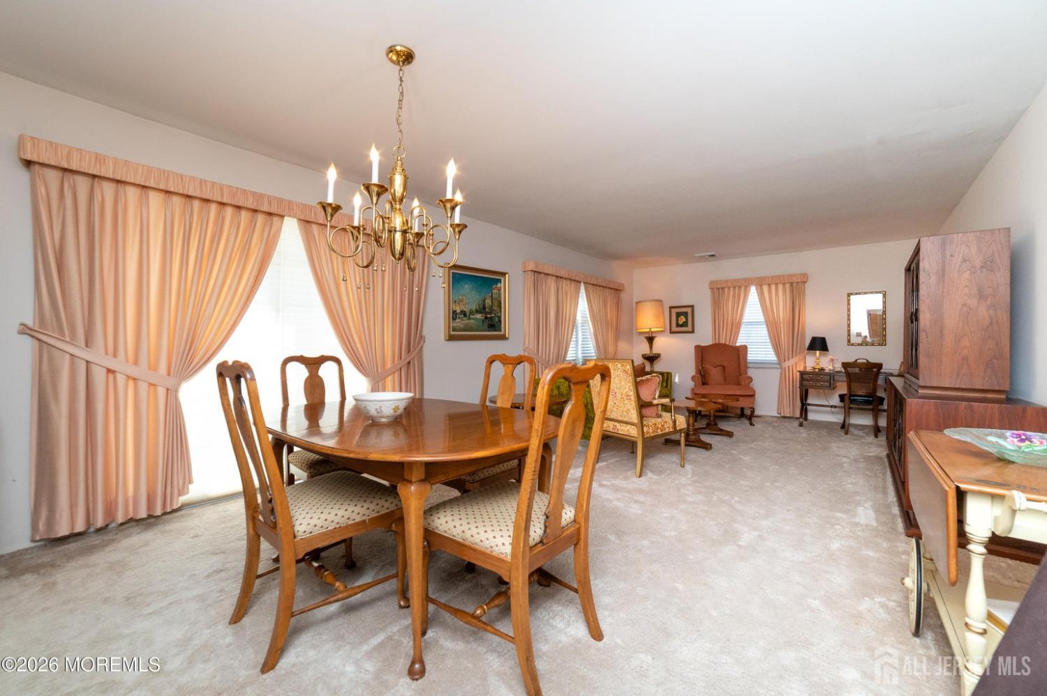 2 Brentwood Road Old Bridge, NJ 07747 - Photo 8 of 30 a dining room with furniture a chandelier and a rug