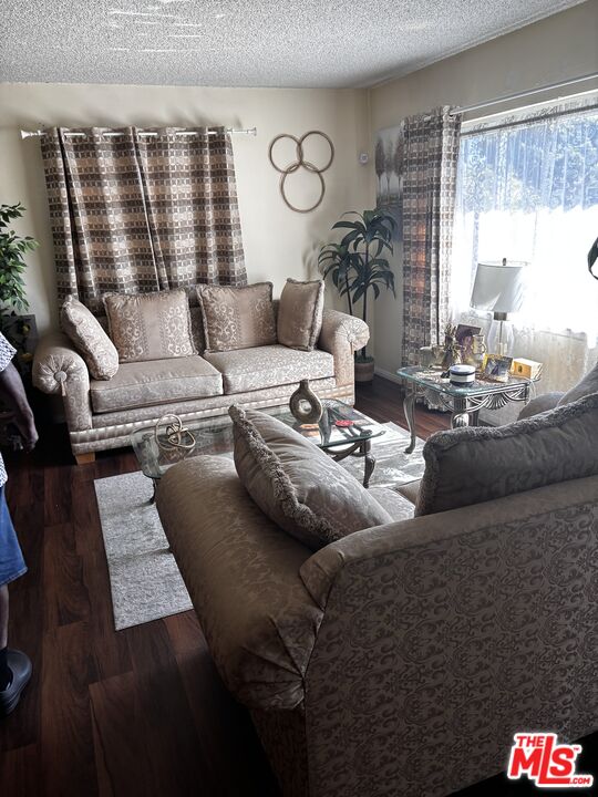 729 East 154th Street Compton, CA 90220 - Photo 2 of 10 a living room with furniture and a large window