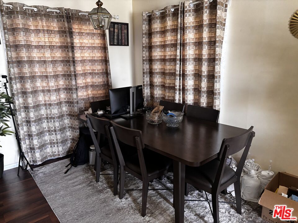 729 East 154th Street Compton, CA 90220 - Photo 3 of 10 a view of a workspace with furniture and a potted plant