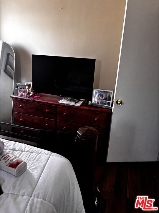 729 East 154th Street Compton, CA 90220 - Photo 8 of 10 a room with a bed and television