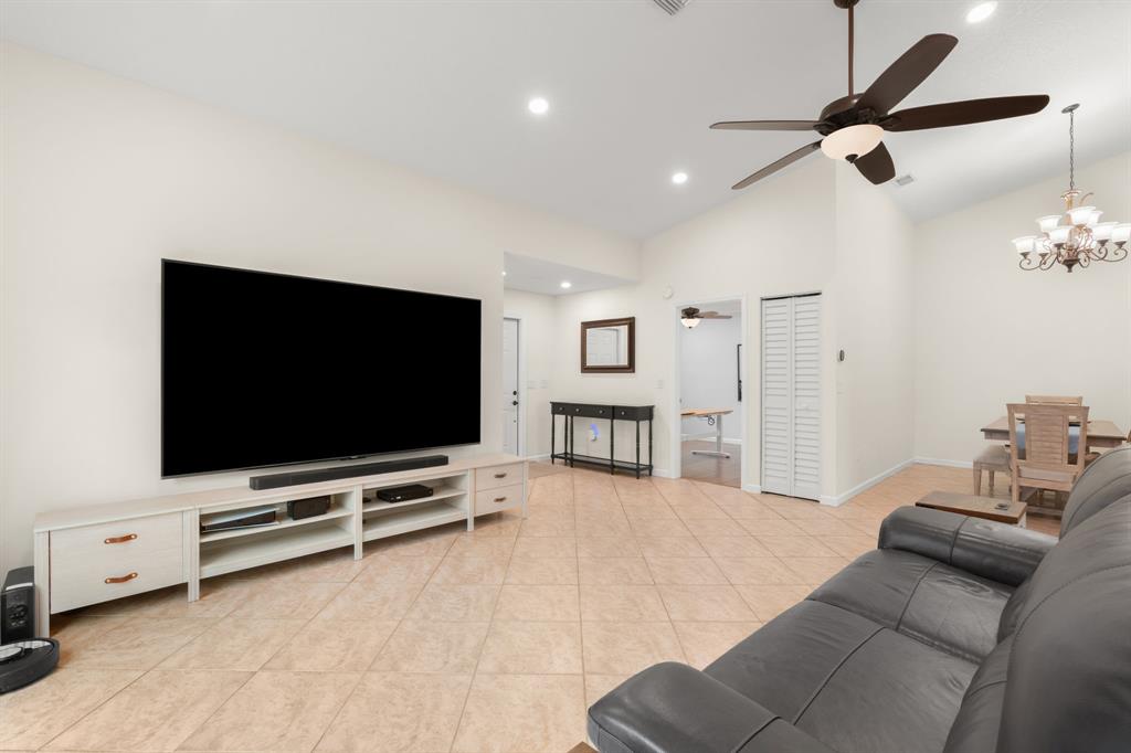 9106 Southwest 22nd Street, Unit D Boca Raton, FL 33428 - Photo 13 of 41 a living room with furniture and a flat screen tv