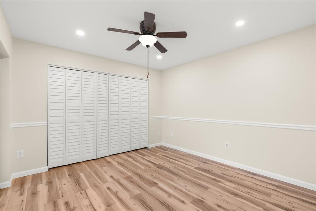 9106 Southwest 22nd Street, Unit D Boca Raton, FL 33428 - Photo 19 of 41 wooden floor in an empty room