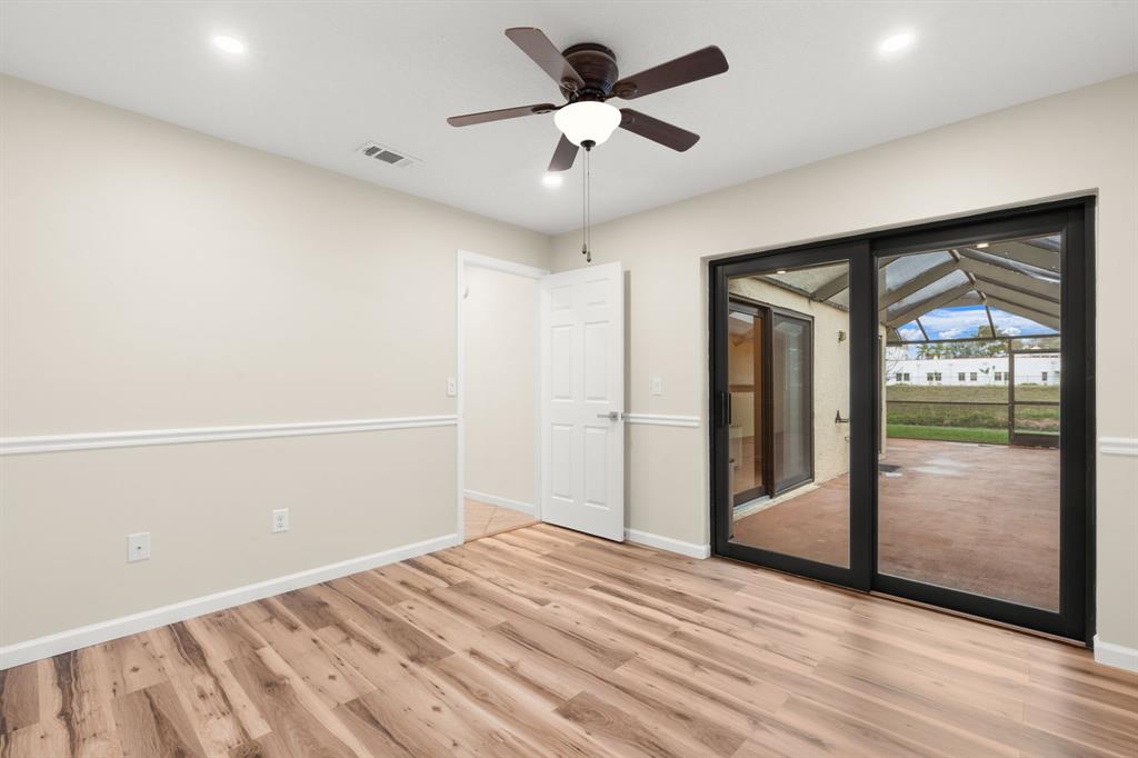 9106 Southwest 22nd Street, Unit D Boca Raton, FL 33428 - Photo 20 of 41 a view of a livingroom with a ceiling fan and window