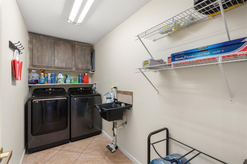 9106 Southwest 22nd Street, Unit D Boca Raton, FL 33428 - Photo 24 of 41 a utility room with dryer and washer