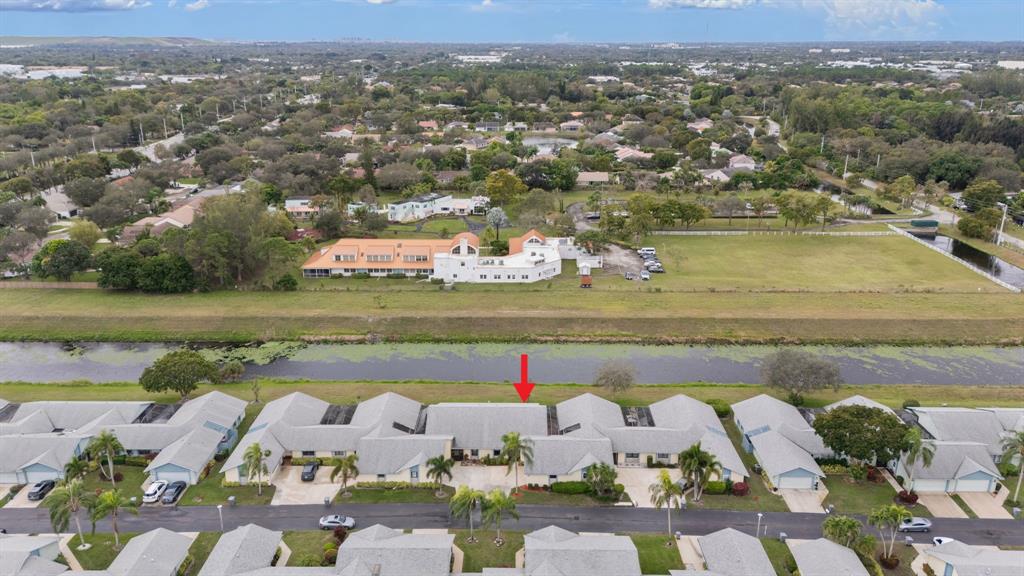 9106 Southwest 22nd Street, Unit D Boca Raton, FL 33428 - Photo 32 of 41 an aerial view of a house with a lake view