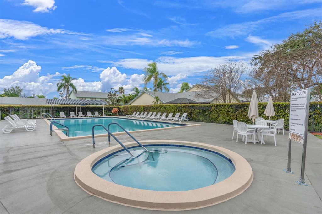 9106 Southwest 22nd Street, Unit D Boca Raton, FL 33428 - Photo 40 of 41 a view of swimming pool with outdoor seating