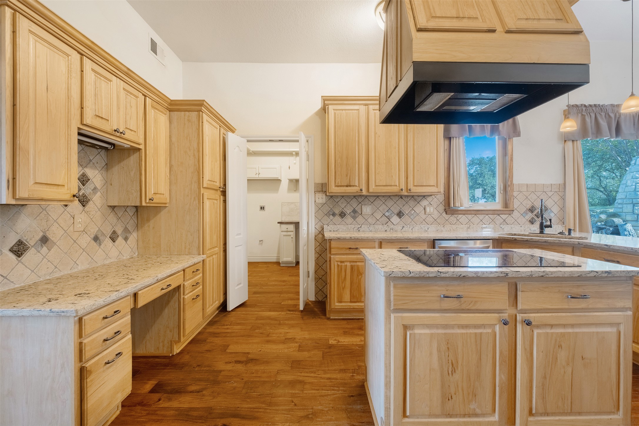 360 Sunset Ridge Drive Liberty Hill, TX 78642 - Photo 13 of 40 a kitchen with a sink a stove and cabinets