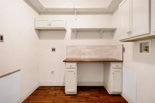 a hallway with cabinets