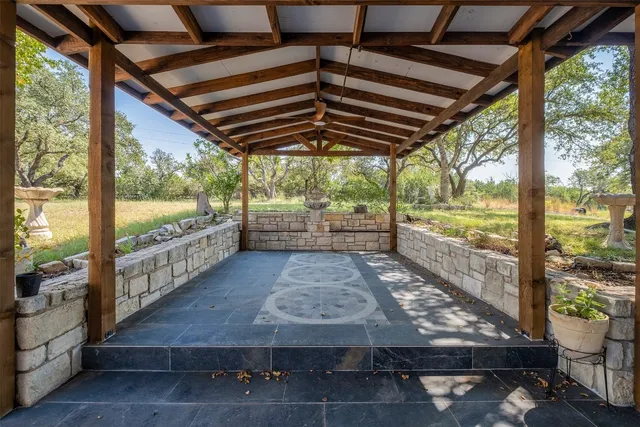 a view of a porch with wooden floor