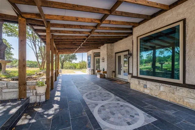 a view of a porch with wooden floor