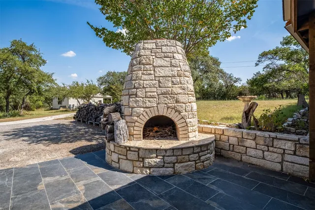 a view of a couches in the patio with a fire pit