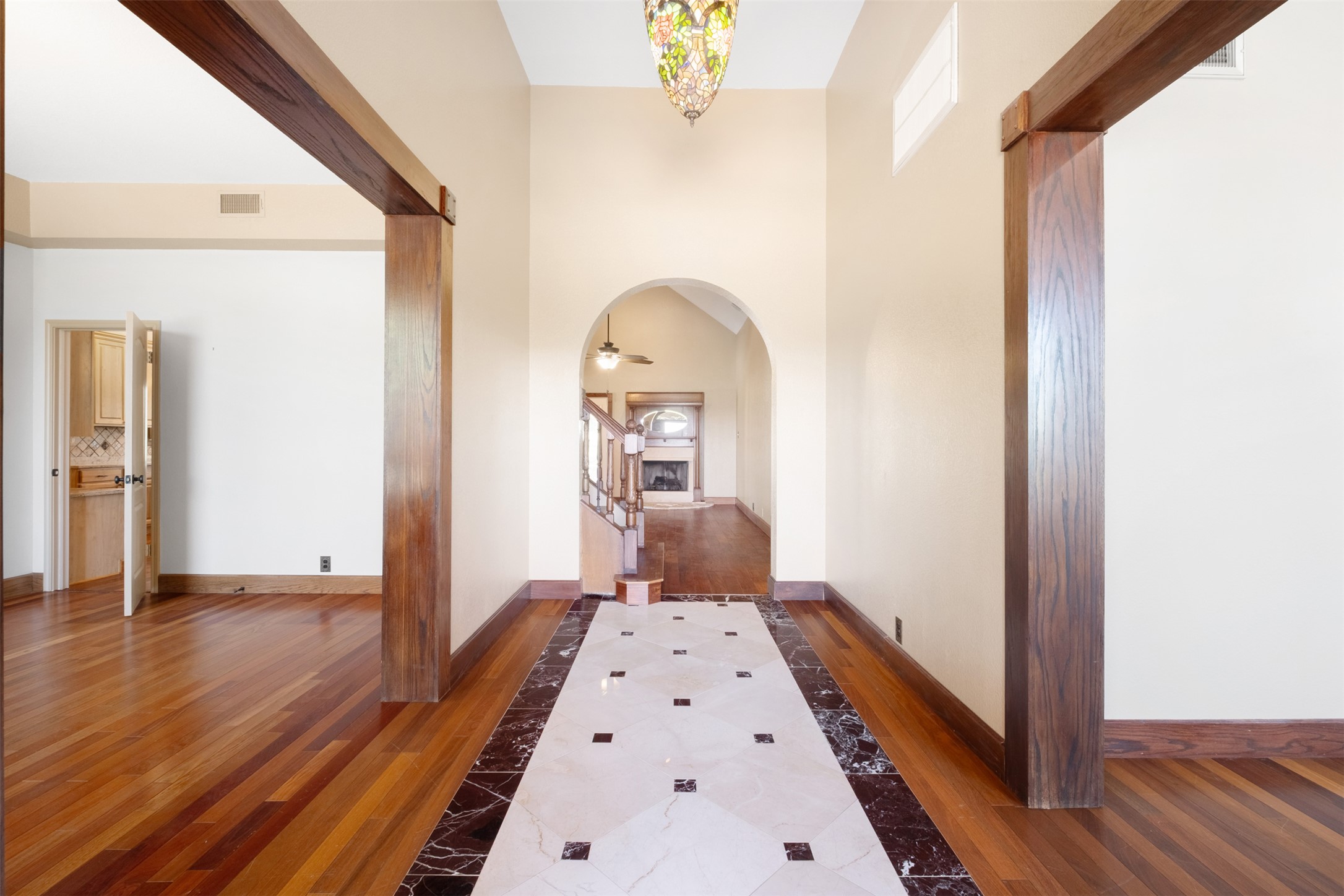 360 Sunset Ridge Drive Liberty Hill, TX 78642 - Photo 7 of 40 a view of a hallway view with wooden floor and staircase