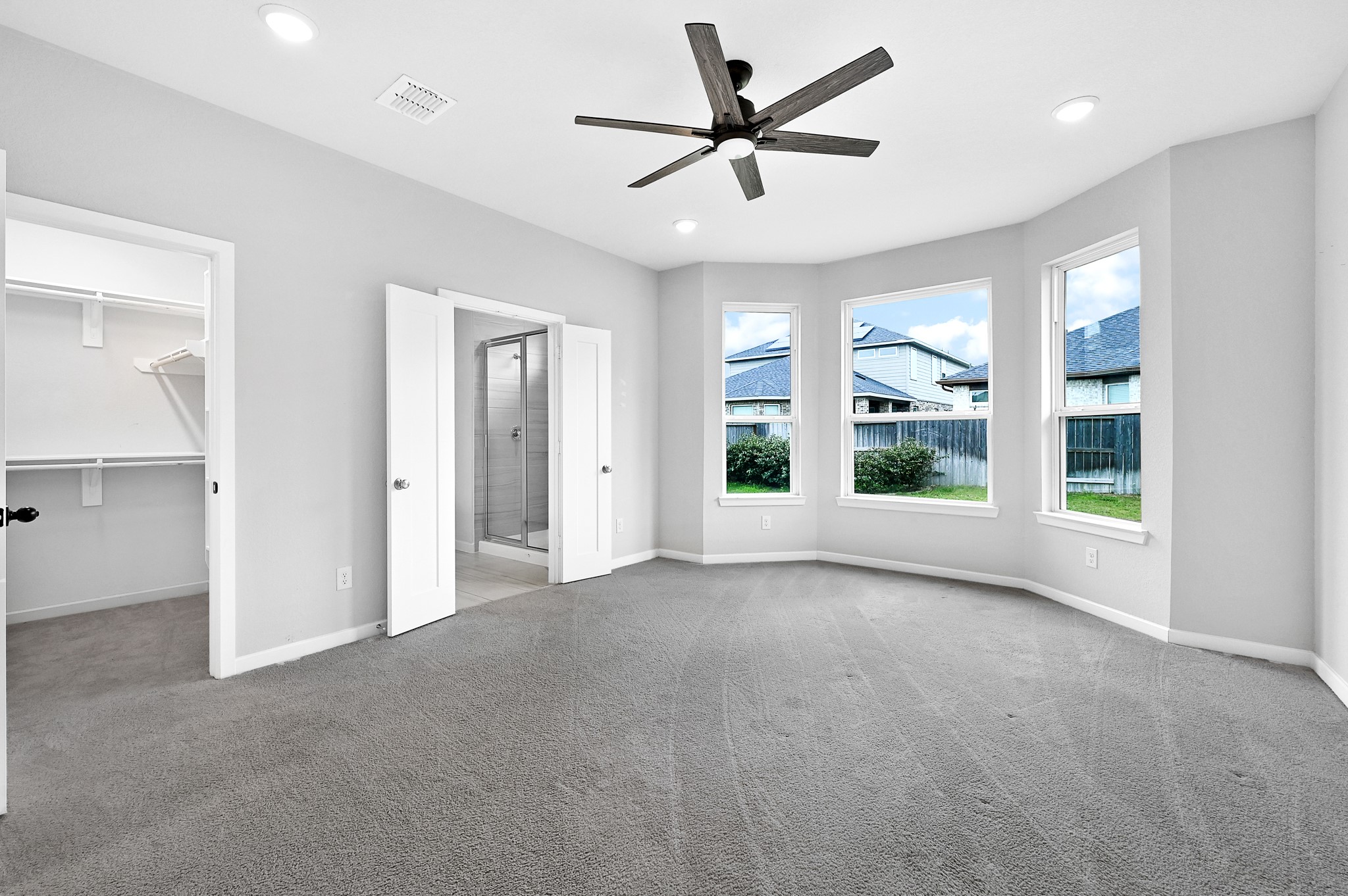 9119 Brixham Drive Cypress, TX 77433 - Photo 15 of 23 a view of a livingroom with a ceiling fan and windows