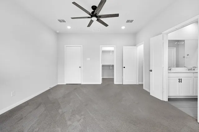 a bathroom with a double vanity sink and mirror