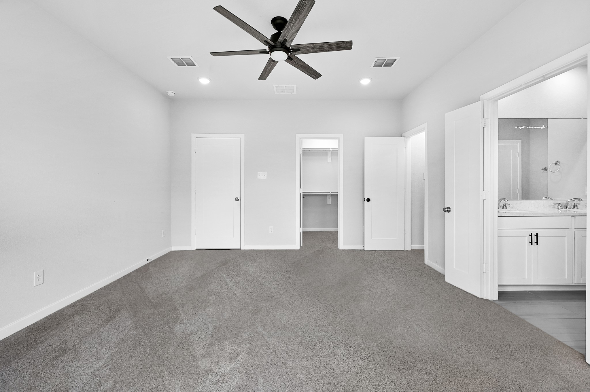 9119 Brixham Drive Cypress, TX 77433 - Photo 16 of 23 a view of a big room with chandelier fan and windows