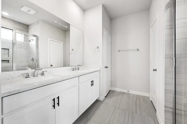 a bathroom with a bathtub and shower