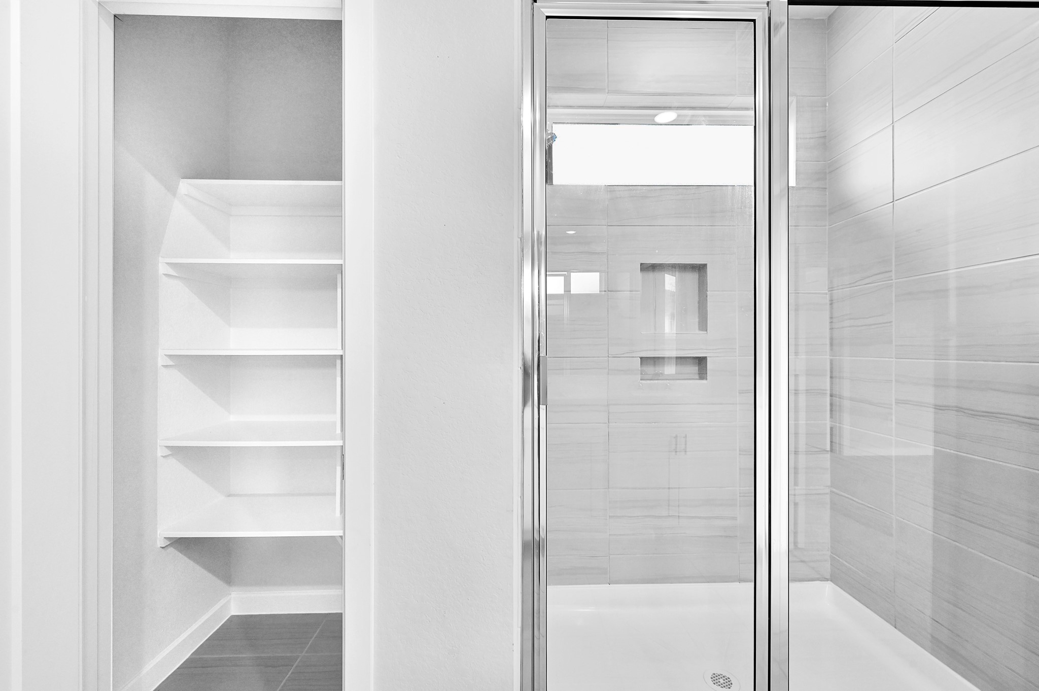 9119 Brixham Drive Cypress, TX 77433 - Photo 19 of 23 a bathroom with a glass shower door