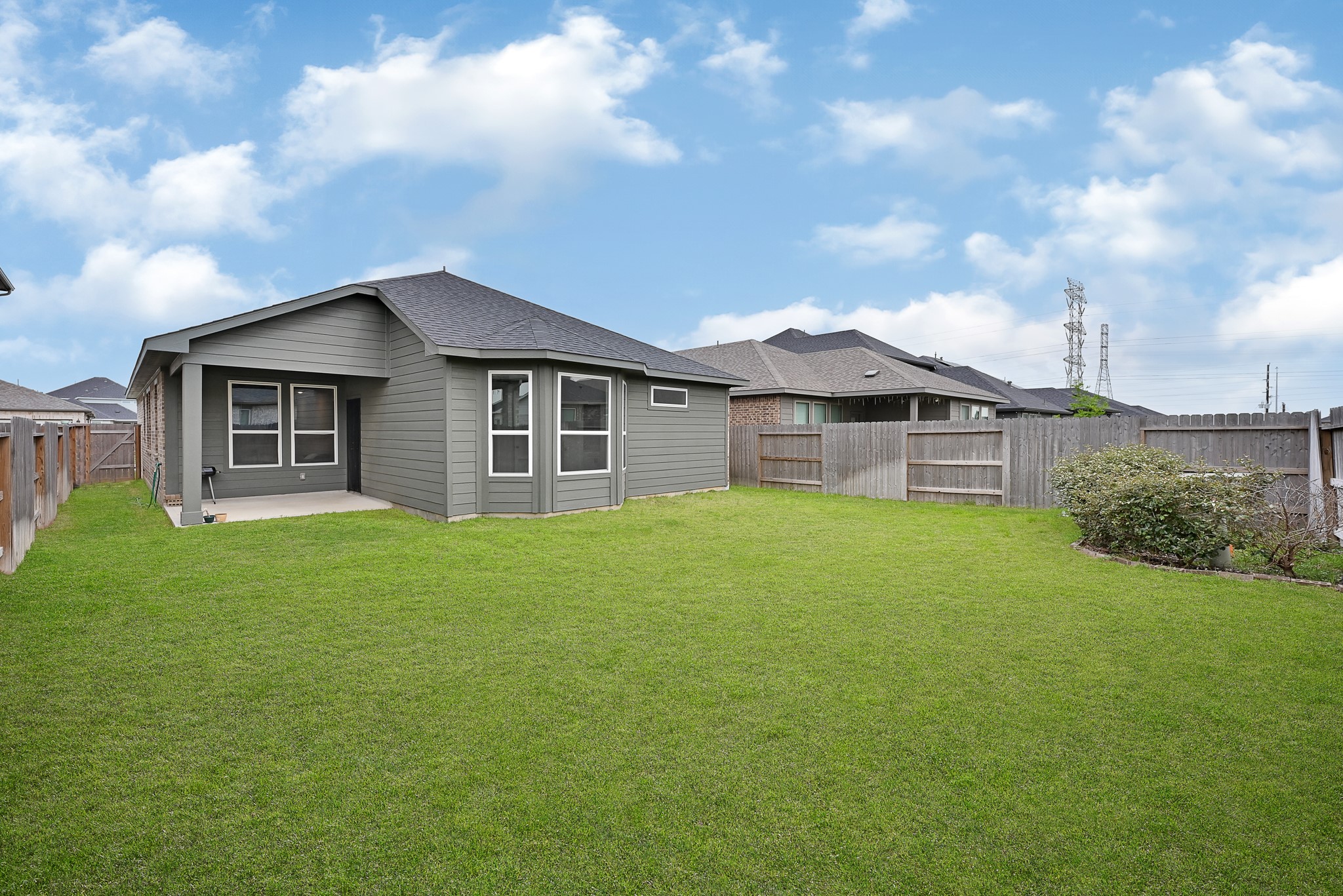 9119 Brixham Drive Cypress, TX 77433 - Photo 22 of 23 a view of a house with a big yard and large tree