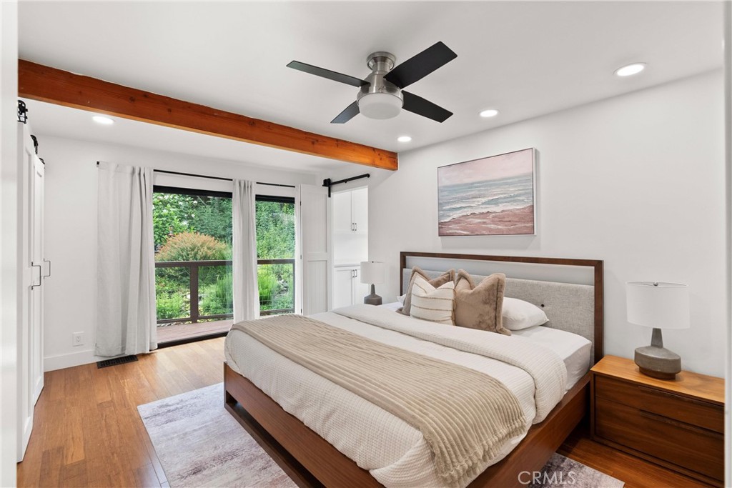 645 Griffith Way Laguna Beach, CA 92651 - Photo 18 of 46 a bedroom with a large bed and a large window