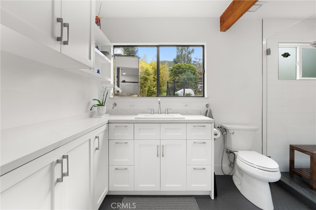 645 Griffith Way Laguna Beach, CA 92651 - Photo 20 of 46 a bathroom with a sink and a toilet