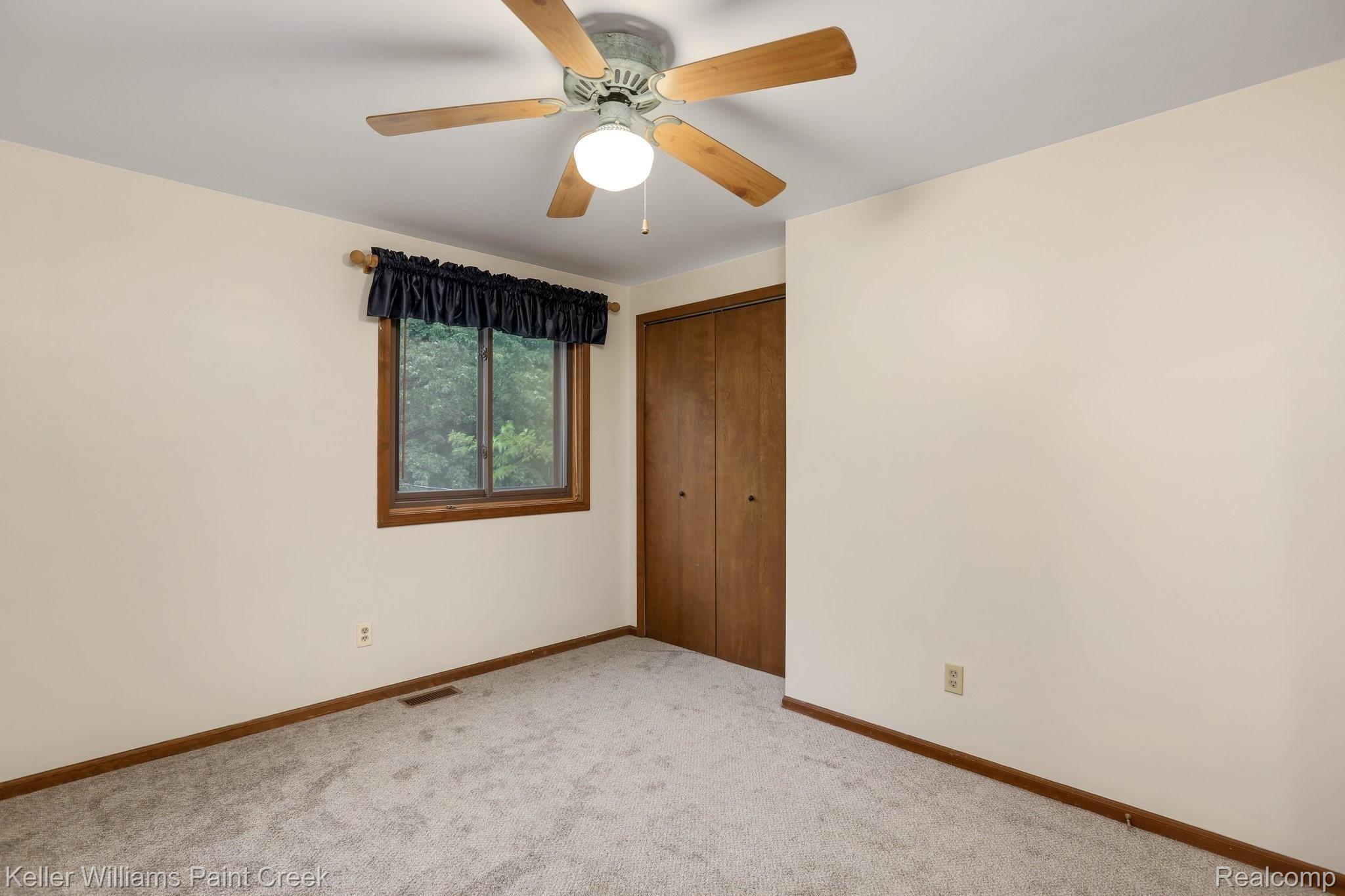 8179 Oakhill Road Clarkston, MI 48348 - Photo 16 of 38 Second bedroom with ample closet storage.