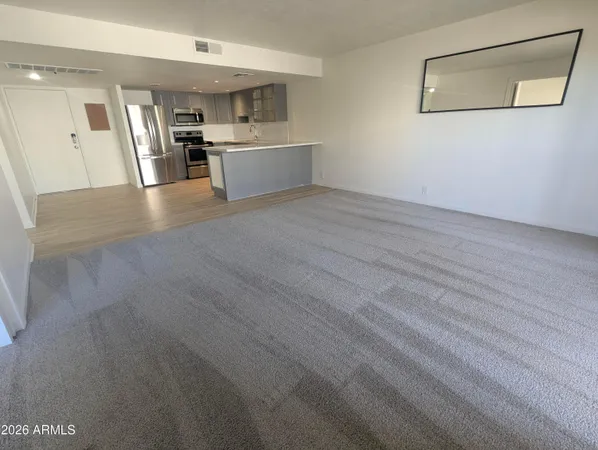 a view of a kitchen with wooden floor