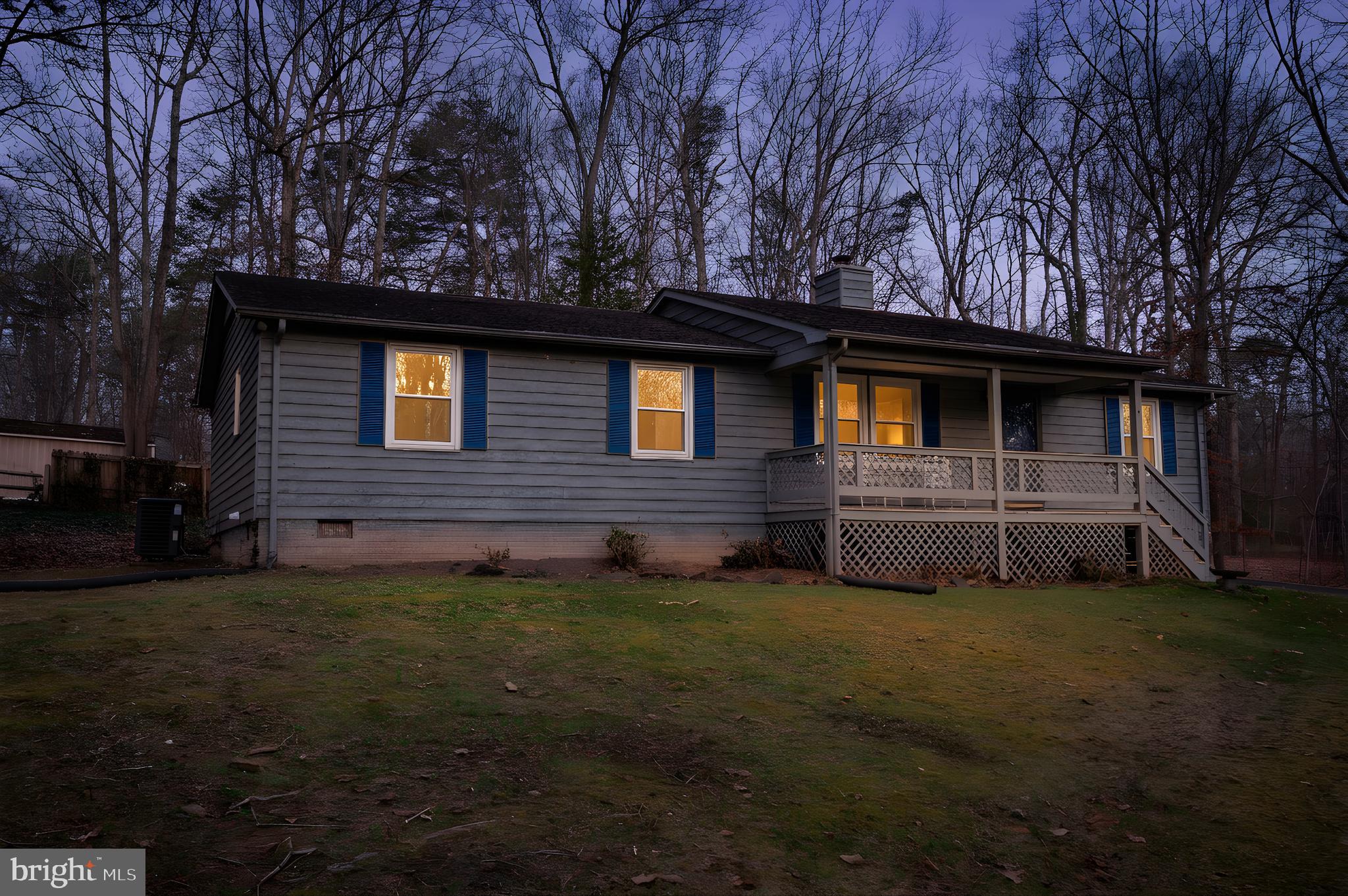 12402 Toll House Road Spotsylvania, VA 22551 - Photo 1 of 59 a front view of a house with yard and trees