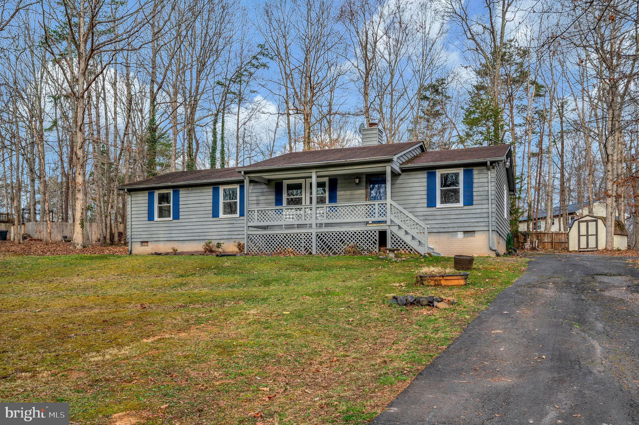 12402 Toll House Road Spotsylvania, VA 22551 - Photo 2 of 59 a front view of a house with a yard