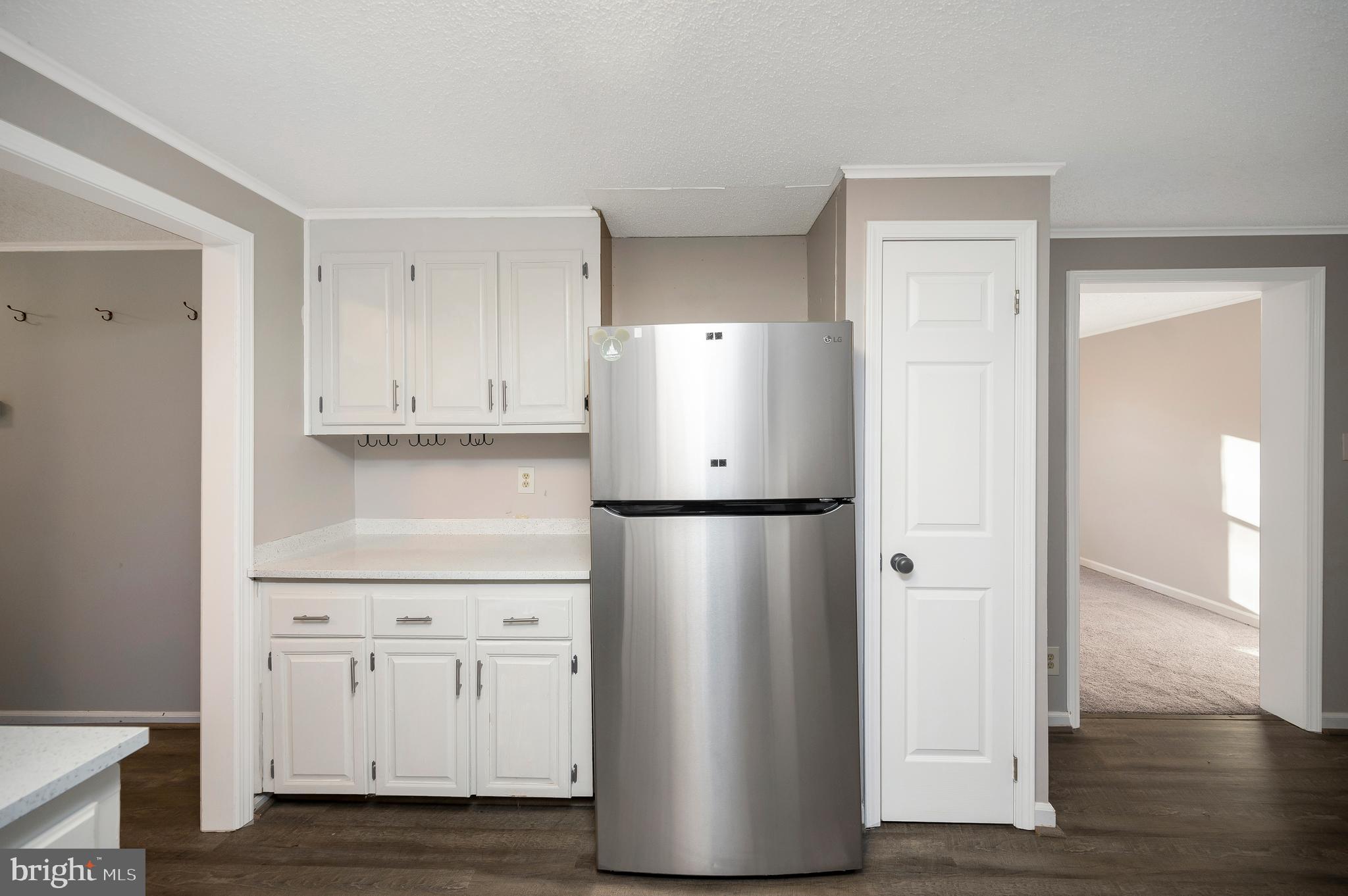 12402 Toll House Road Spotsylvania, VA 22551 - Photo 25 of 59 a view of cabinets and wooden floor