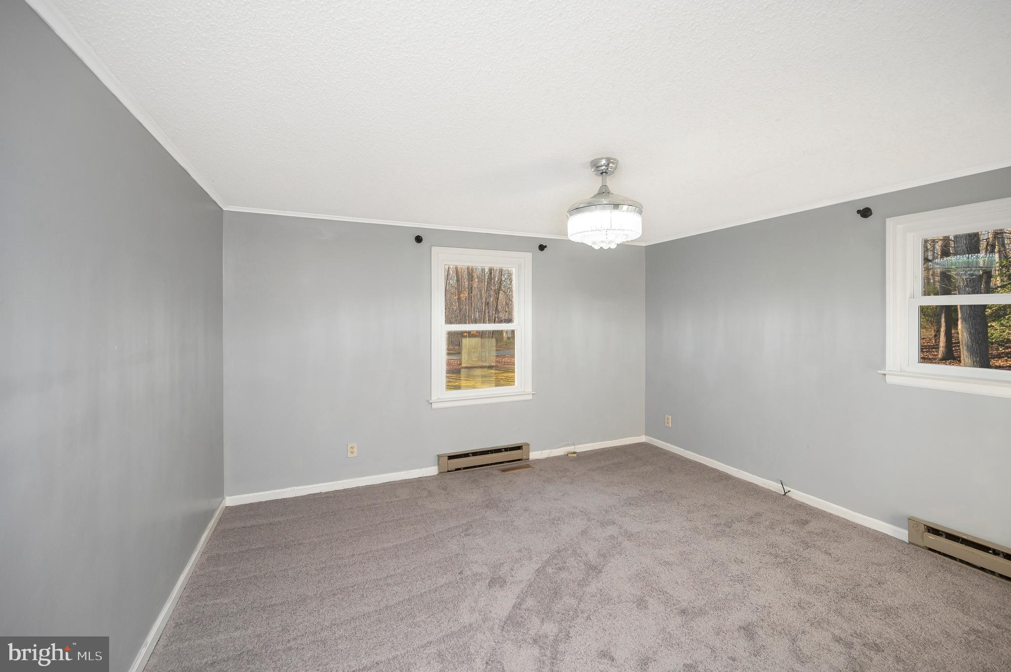 12402 Toll House Road Spotsylvania, VA 22551 - Photo 26 of 59 wooden floor in an empty room with a window