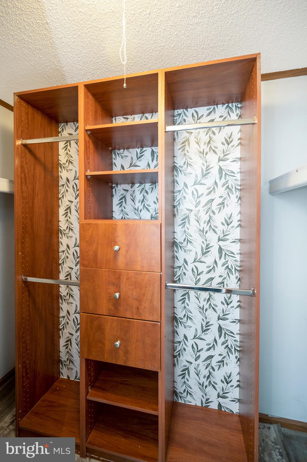 12402 Toll House Road Spotsylvania, VA 22551 - Photo 33 of 59 a view of a small space with racks on the wall